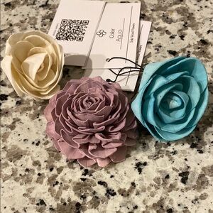 3 wood flower samples in white, aqua, and lavender